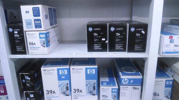 Shelves of HP toner cartridges